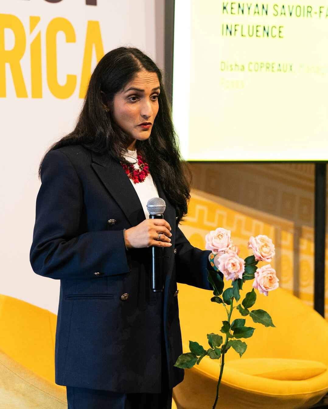 Brazilian woman confidently speaking during a presentation to a group