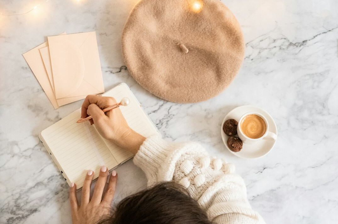 person journaling for self reflection